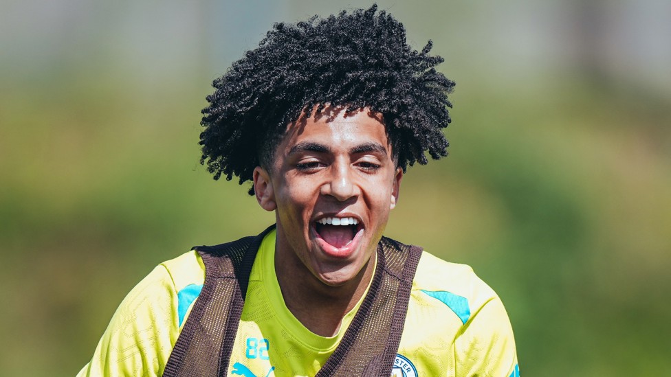 SMILES BETTER : Rico Lewis enjoys himself in training