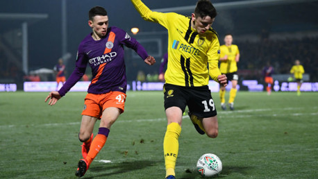 PRESSING HARD: Phil Foden looks to win possession in a dangerous area