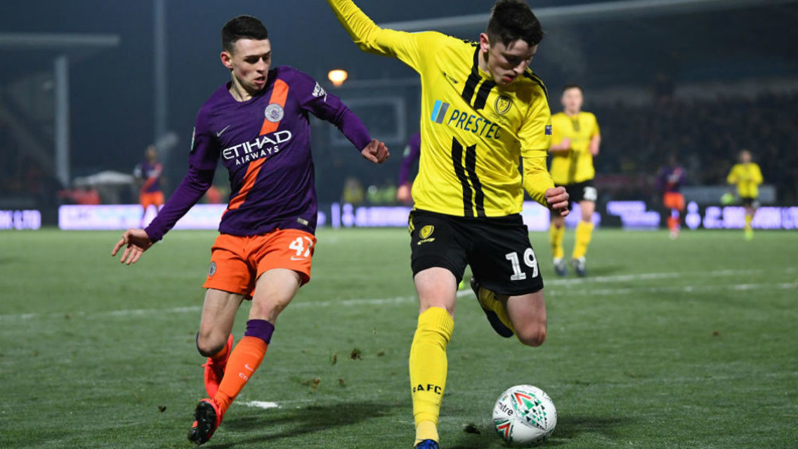 PRESSING HARD: Phil Foden looks to win possession in a dangerous area