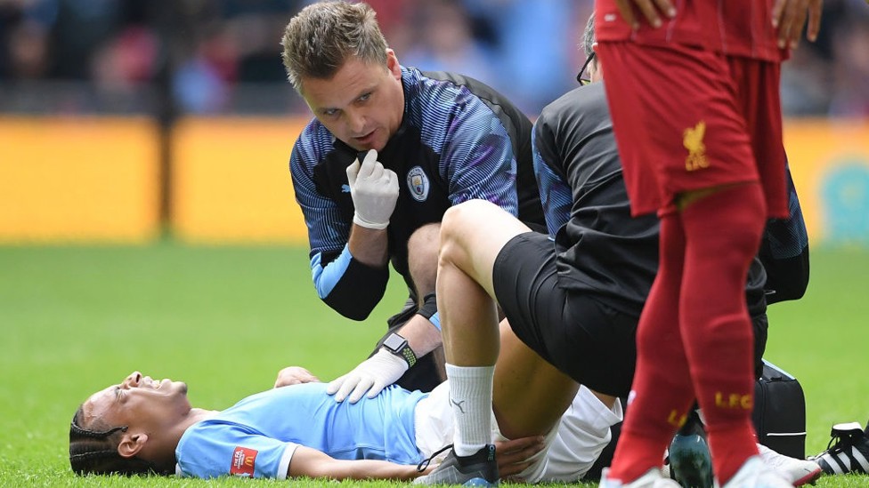 SORE : Leroy Sane is forced off through injury after 10 minutes at Wembley.
