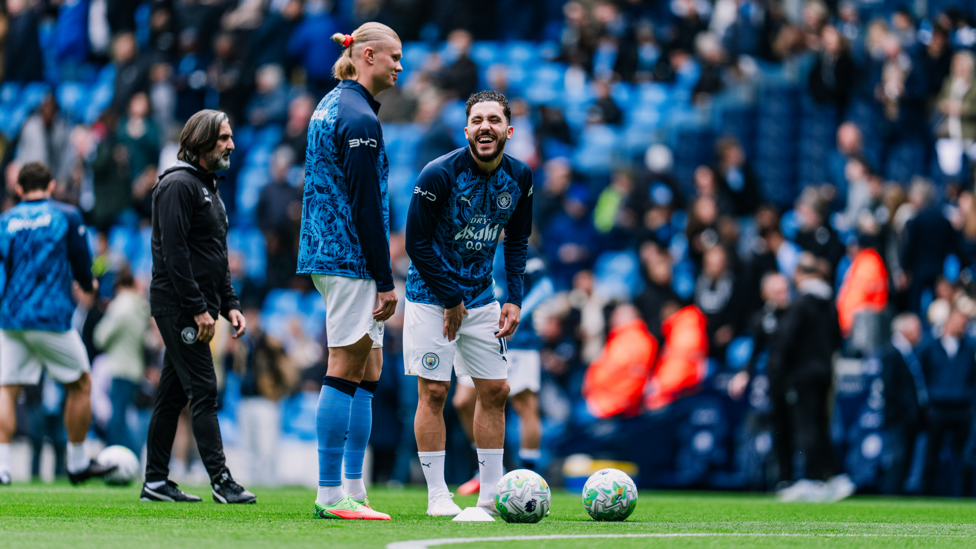 ALL SMILES : Good vibes from Haaland and Cherki as kick-off approaches.