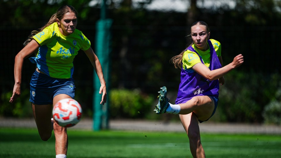 LETS FLY : Codie Thomas strikes under pressure from Gracie Prior. 