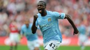 A Manchester City player in a light blue kit with number 42 celebrates by clenching their fist during a match.