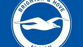 Brighton & Hove Albion logo featuring a white seagull in a blue circle with the club's name.