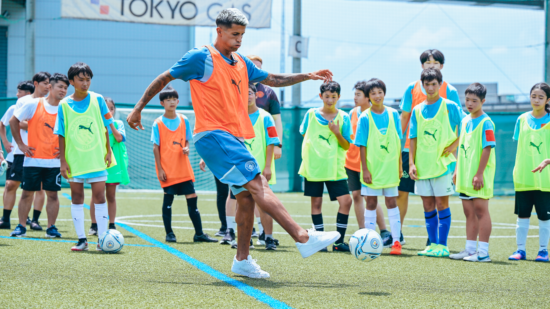 BEST FOOT FORWARD: Joao Cancelo shares some tips at the community football festival.