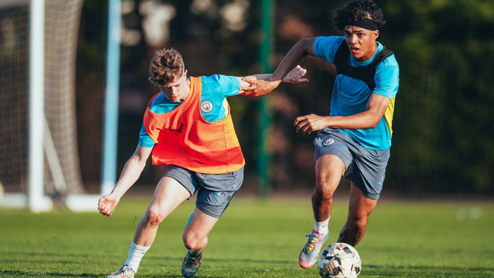 HEAD TO HEAD : Rhys Thomas and Luca Fletcher battle for the ball. 