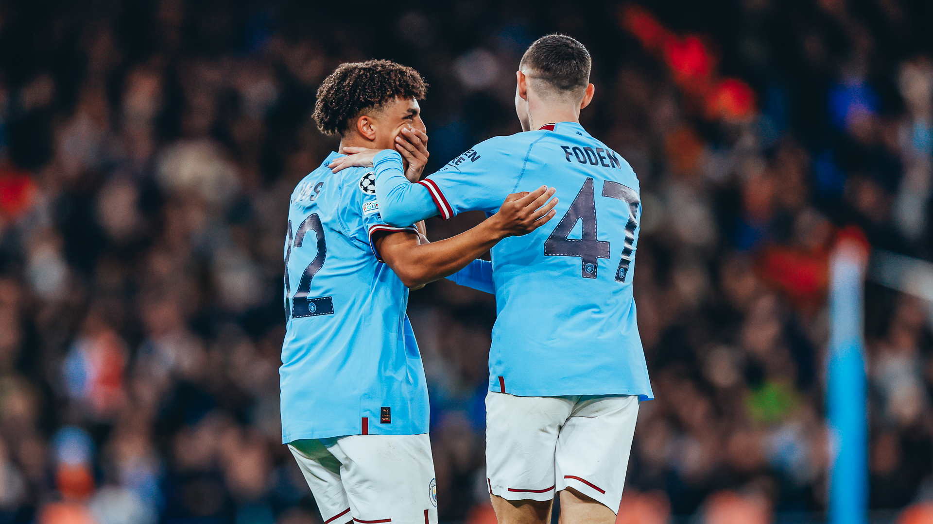 SMILING PAIR : Phil Foden congratulates Rico Lewis on his Sevilla goal