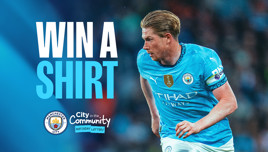 Promotional image for Manchester City's City in the Community matchday lottery, featuring a player in a blue shirt, encouraging fans to win a shirt.