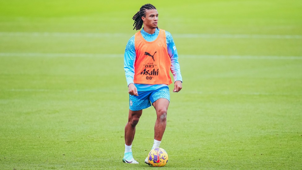 UNDER CONTROL : Nathan Ake searches for a team-mate