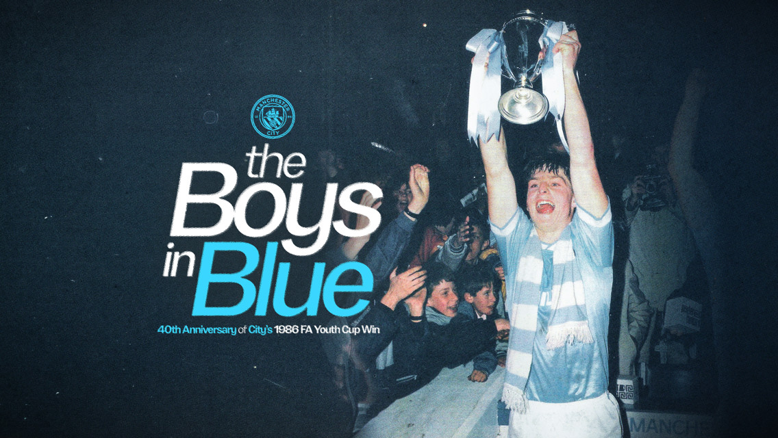 Celebration of Manchester City's 1986 FA Youth Cup win with a player holding the trophy, and the text 'the Boys in Blue' alongside the club's crest.