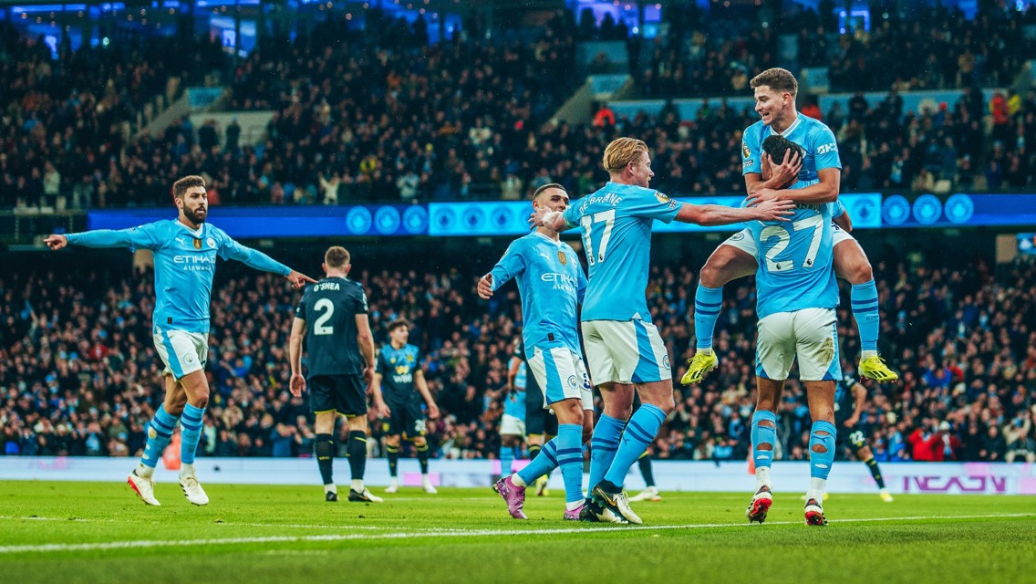 SCORER AND PROVIDER: Alvarez celebrates with Nunes.