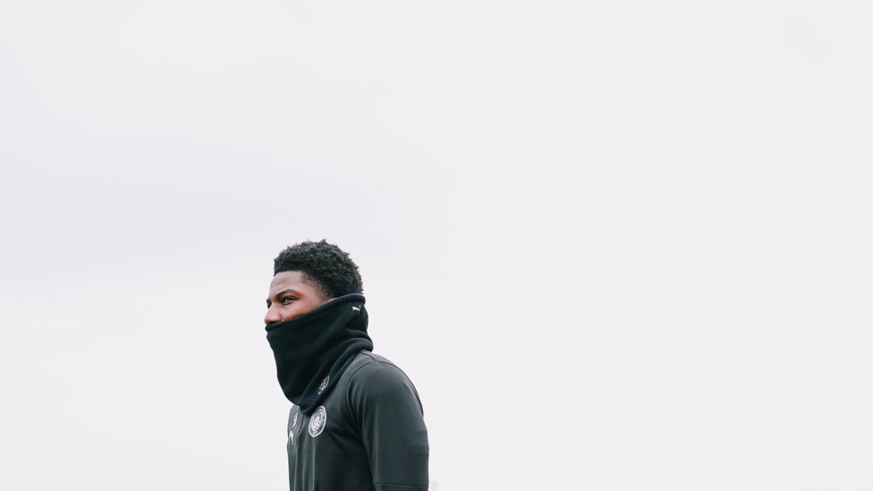 WRAPPED UP : Ryan McAidoo prepared for the chilly Manchester wind.