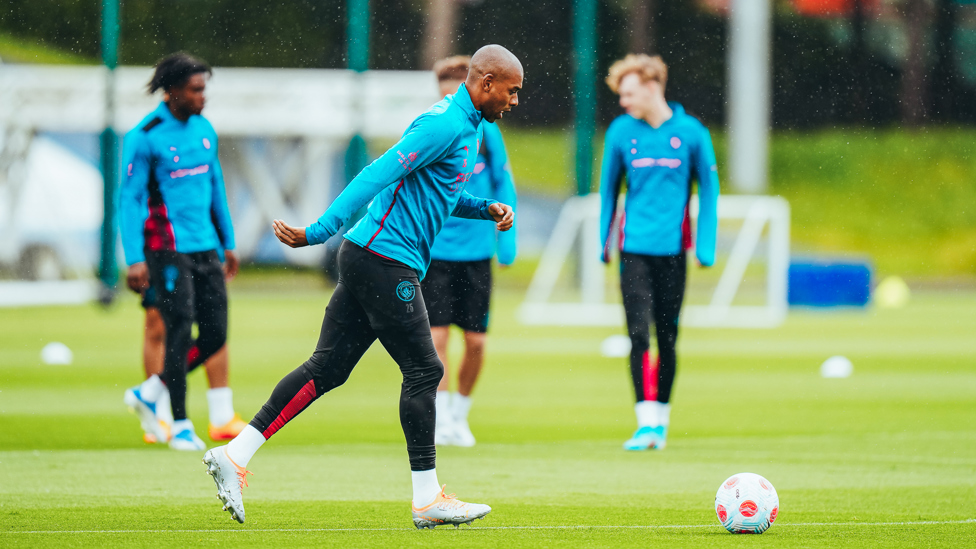 LEADER OF MEN : Fernandinho gets involved as some of the younger squad members look on