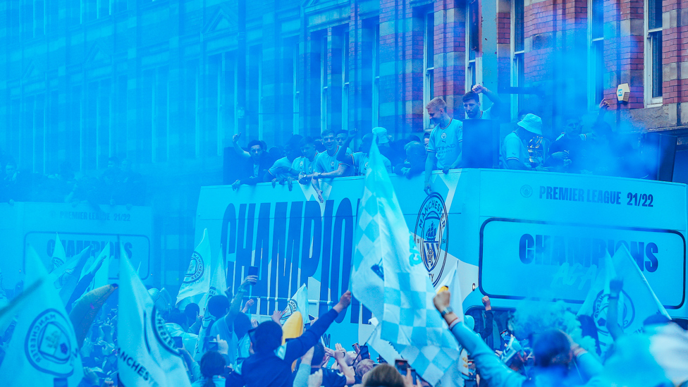 CENTRE OF ATTENTION: Thousands of fans salute the City squad as they make their way through the city centre