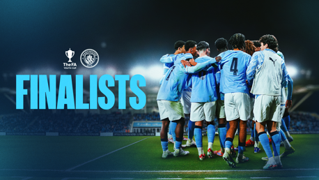 A group of players in light blue jerseys huddle on a soccer field with 'The FA Youth Cup' and 'Manchester City' logos above the word 'FINALISTS'.