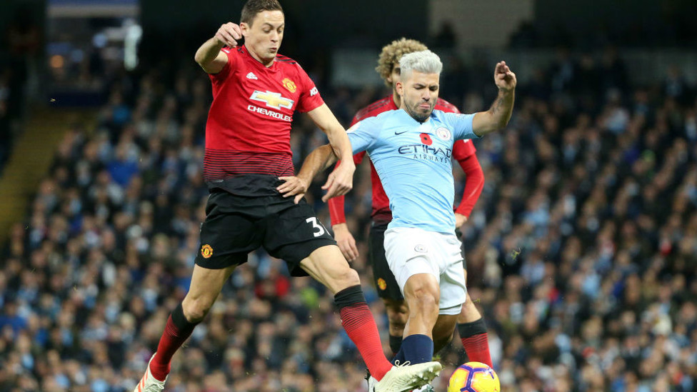 HAIR WE GO : Sergio Aguero, sporting his new silver hair style, powers at the United defence