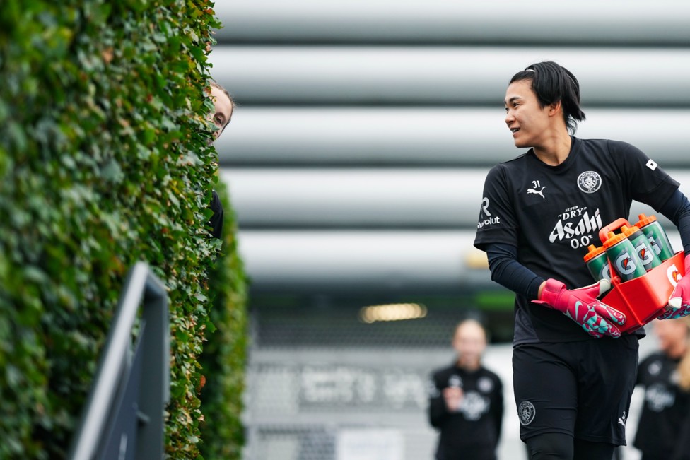 NOW YOU SEE ME: Katie Startup hides from our photographer as Ayaka Yamashita watches on