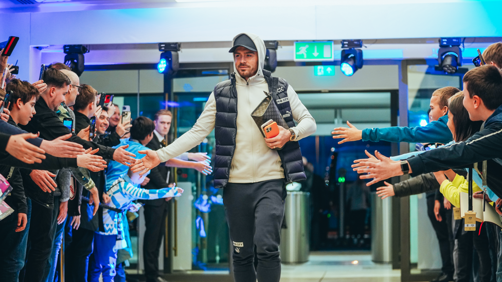 GREALISH GREETING : Jack arrives at the stadium and greets the fans on his way in.