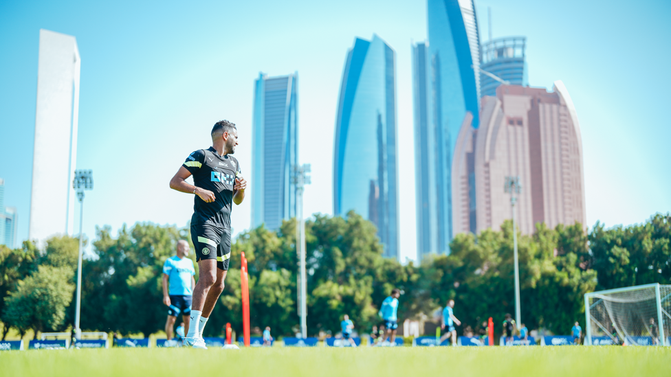 WATCHED OVER : Riyad Mahrez gets involved in front of the skyscrapers of Abu Dhabi