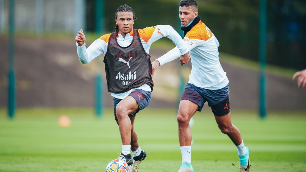 TOUCH TIGHT : Nathan Ake under pressure from Rodrigo