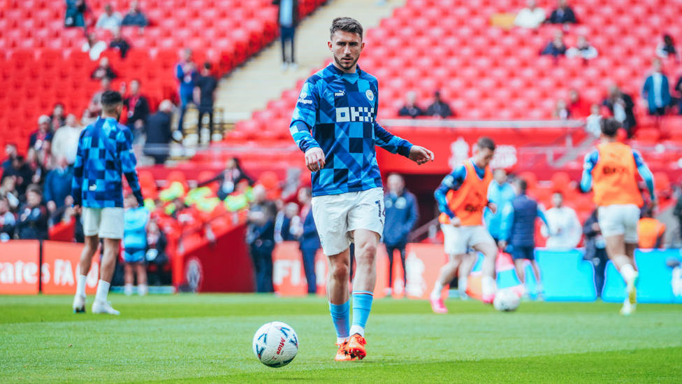GETTING WARM : Aymeric Laporte and the team prepare for kick-off.