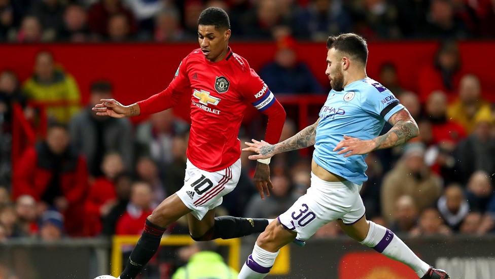 EARLY THREAT : Nicolas Otamendi keeps Marcus Rashford under watch