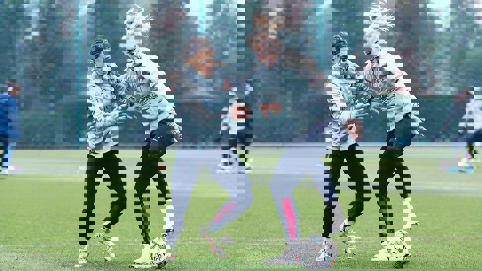 HARD YARDS : Hayley Raso and Alex Greenwood battle for the ball