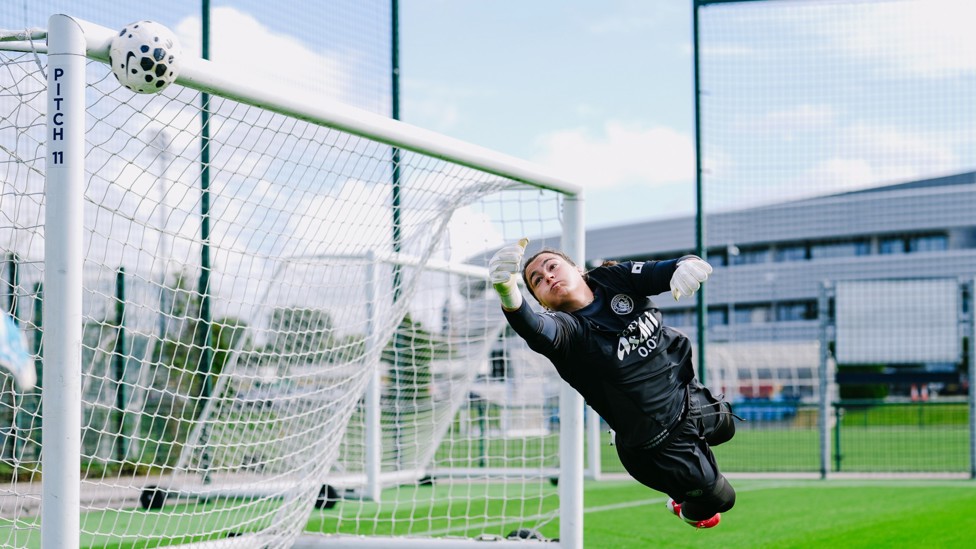 OFF THE WOODWORK : Eartha Cummings makes a diving save.