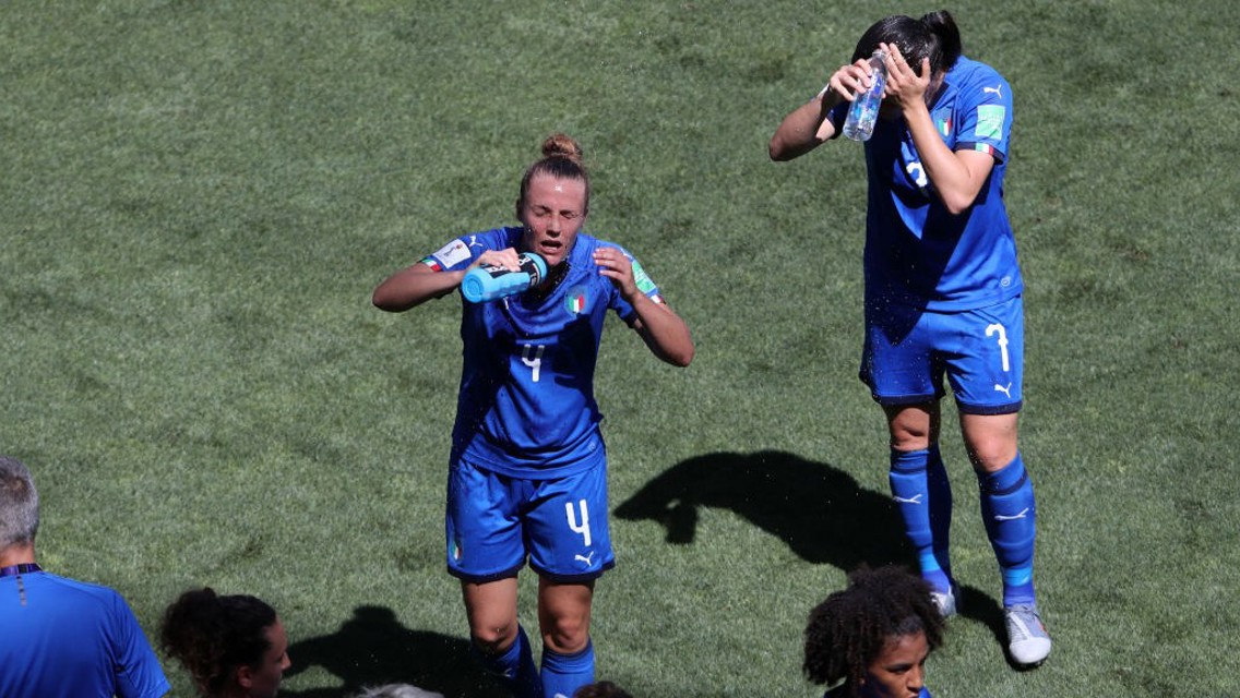 MUCH NEEDED: Italy take on water in the cooling break taken in their match against the Netherlands.