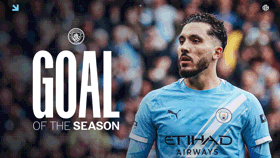 Blurred person in a Manchester City jersey, with text 'GOAL OF THE SEASON' and Manchester City logo visible.