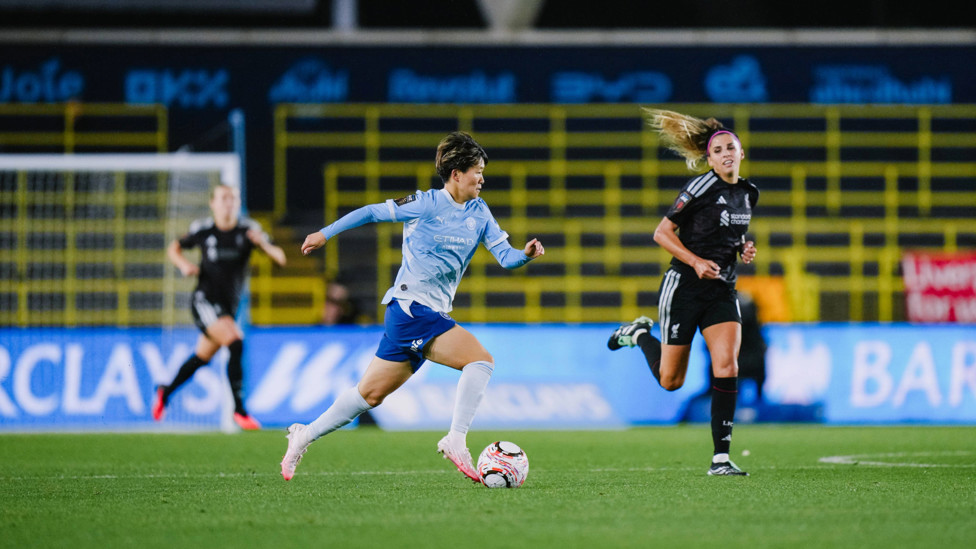 Driving force : Aoba Fujino looking to glide past the Liverpool defence
