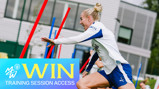A woman in sports attire enthusiastically participates in a training session, sprinting near colored poles. The graphic overlay reads 'WIN TRAINING SESSION ACCESS' with the Manchester City logo.