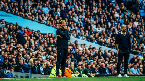 Guardiola (right) and Klopp watch on in 2018