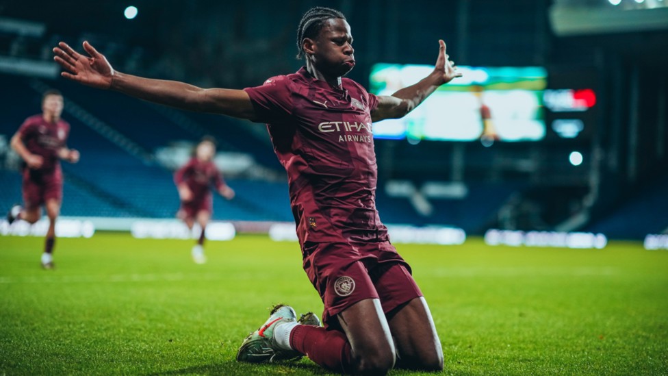 SLIDE RULE: Stephen Mfuni celebrates putting City 2-0 ahead.