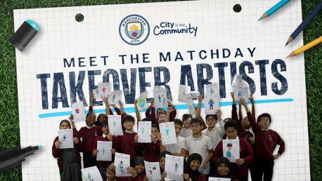 Group of children holding up art drawings with Manchester City and City in the Community logos.