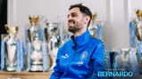 A person in a blue Manchester City tracksuit sits with multiple silver trophies in the background. Text reads 'THANK YOU BERNARDO 2017-2026'.