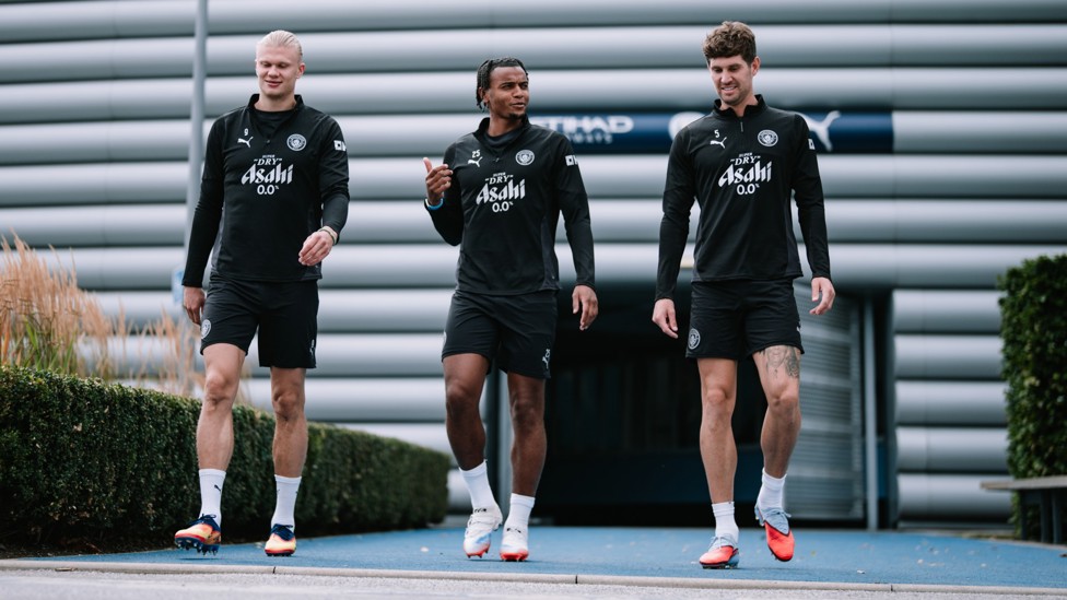 BOYS ARE BACK: Erling Haaland, Manuel Akanji and John Stones on their way into training