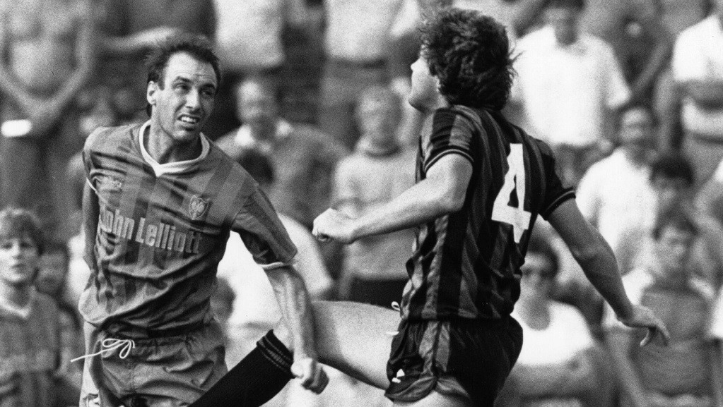 WIMBLEDON v CITY AUGUST 1984 : One of the few games Parlane and Tolmie played in during their second season at Maine Road - here, Kevin Bond challenges for the ball