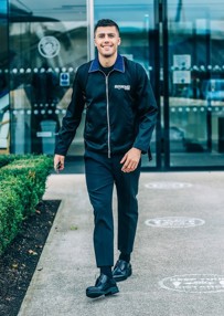 SHARP DRESSED MAN: Rodrigo was all smiles ahead of the flight to Athens