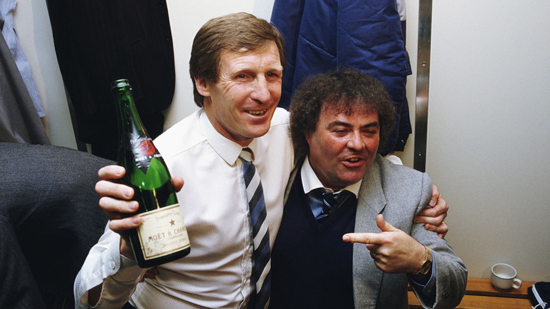 LOVELY BUBBLY: Boss Billy McNeill and famed comedian and uber City fan Eddie Large celebrate in the dressing room.