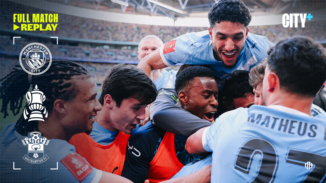 Blurred celebration of Manchester City players during FA Cup match against Southampton. Logos for Manchester City and Southampton FC are visible.