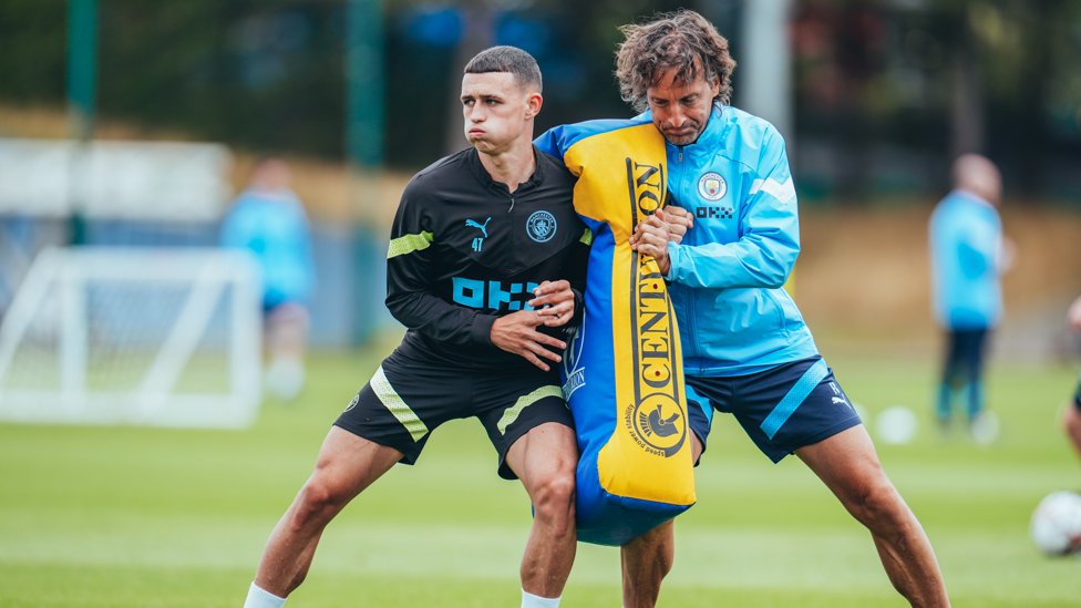 SHOULDER TO SHOULDER : Phil Foden gets stuck into Wednesday's session!