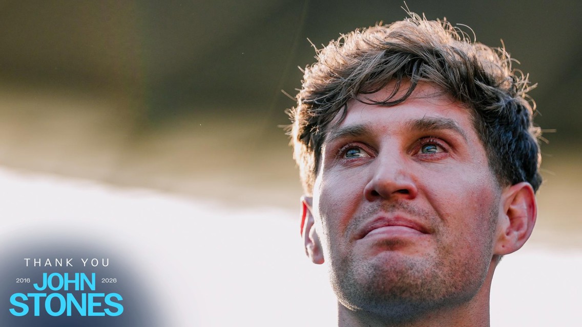 A graphic with 'Thank You John Stones' text and years '2016-2026' displayed in blue font. The background is blurred, showcasing a person's side profile with hair visible.