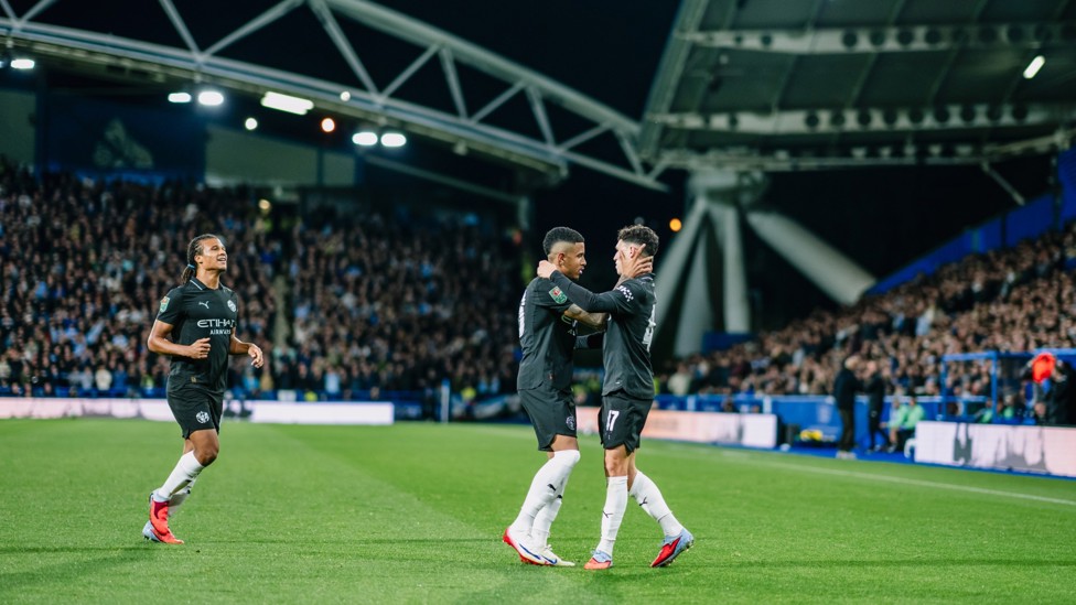 HUGS ALL ROUND: Phil Foden celebrates with Savinho after the City youngster put us ahead