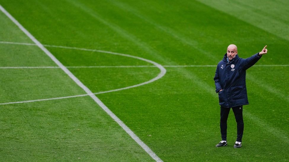 POINT THE WAY : Pep Guardiola directs the session