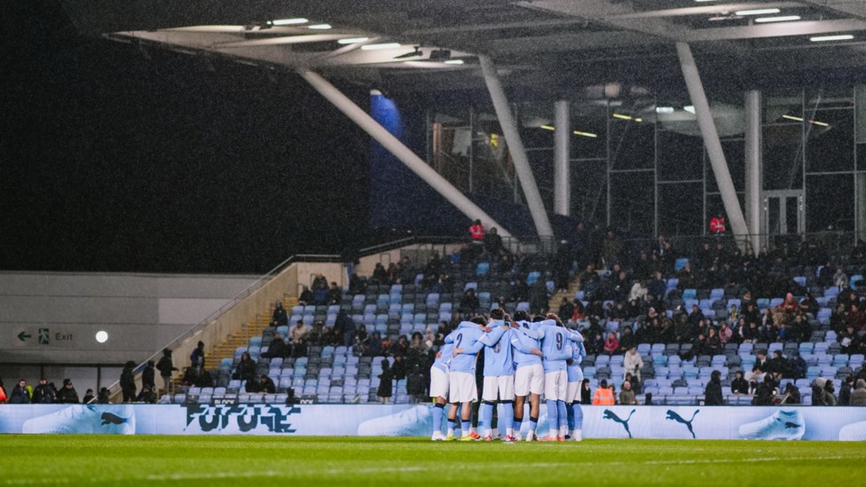TEAM TALK : The squad have a quick huddle just before kick-off.