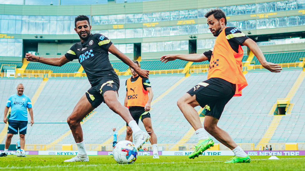 MIDFIELD BATTLE : Riyad Mahrez and Bernardo Silva tussle for possession
