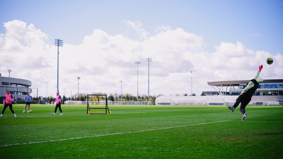 REFLEXES : Ayaka Yamashita gets up high to stop a Lily Murphy strike