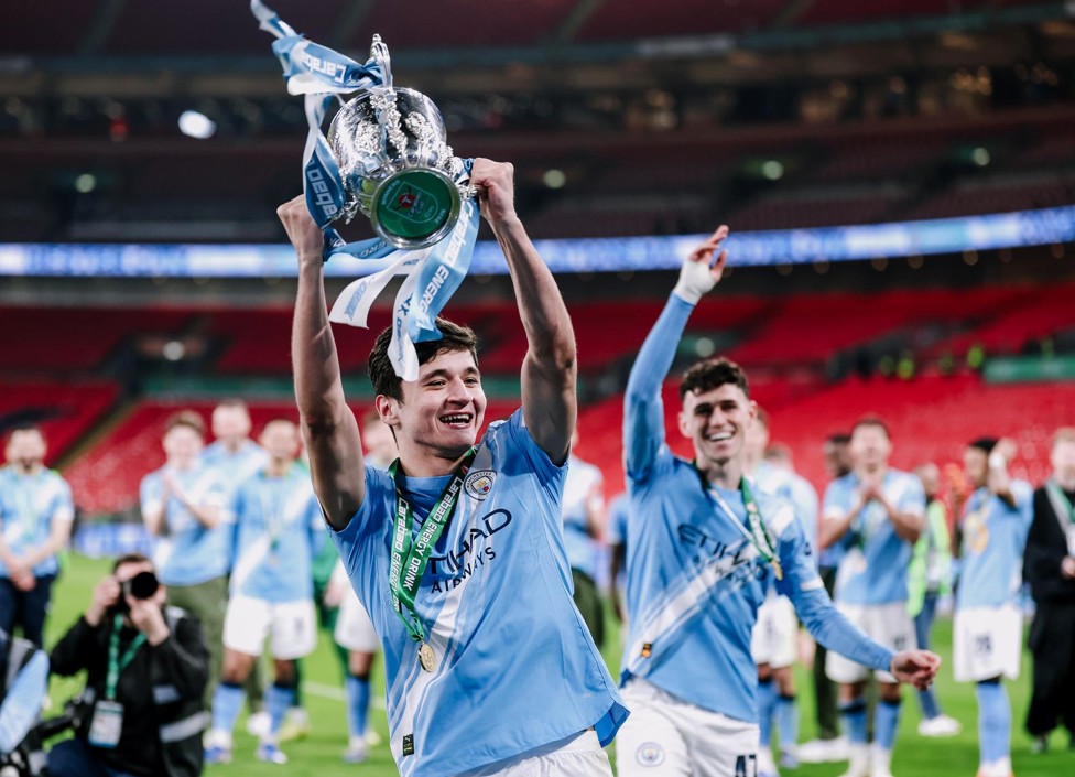 FIRST TROPHY : Khusanov enjoying his first trophy-winning moment with the Club. 