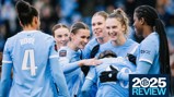 Image shows Manchester City women’s soccer team players in light blue jerseys gathering in a celebratory group. Names and numbers visible on jerseys include Rose (4) and Auba (20). There's a '2025 Review' label in the corner.